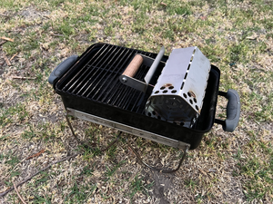 Chimney placed into a Weber go anywhere with the original grill to show it fits