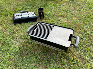 grill/plate combo shown fitted to a weber GA with a grass background