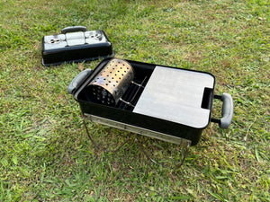 half plate fitted to a weber GA with a chimney inside