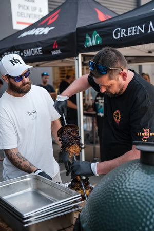 Smoked meat being sliced and served at an American BBQ class in Melbourne