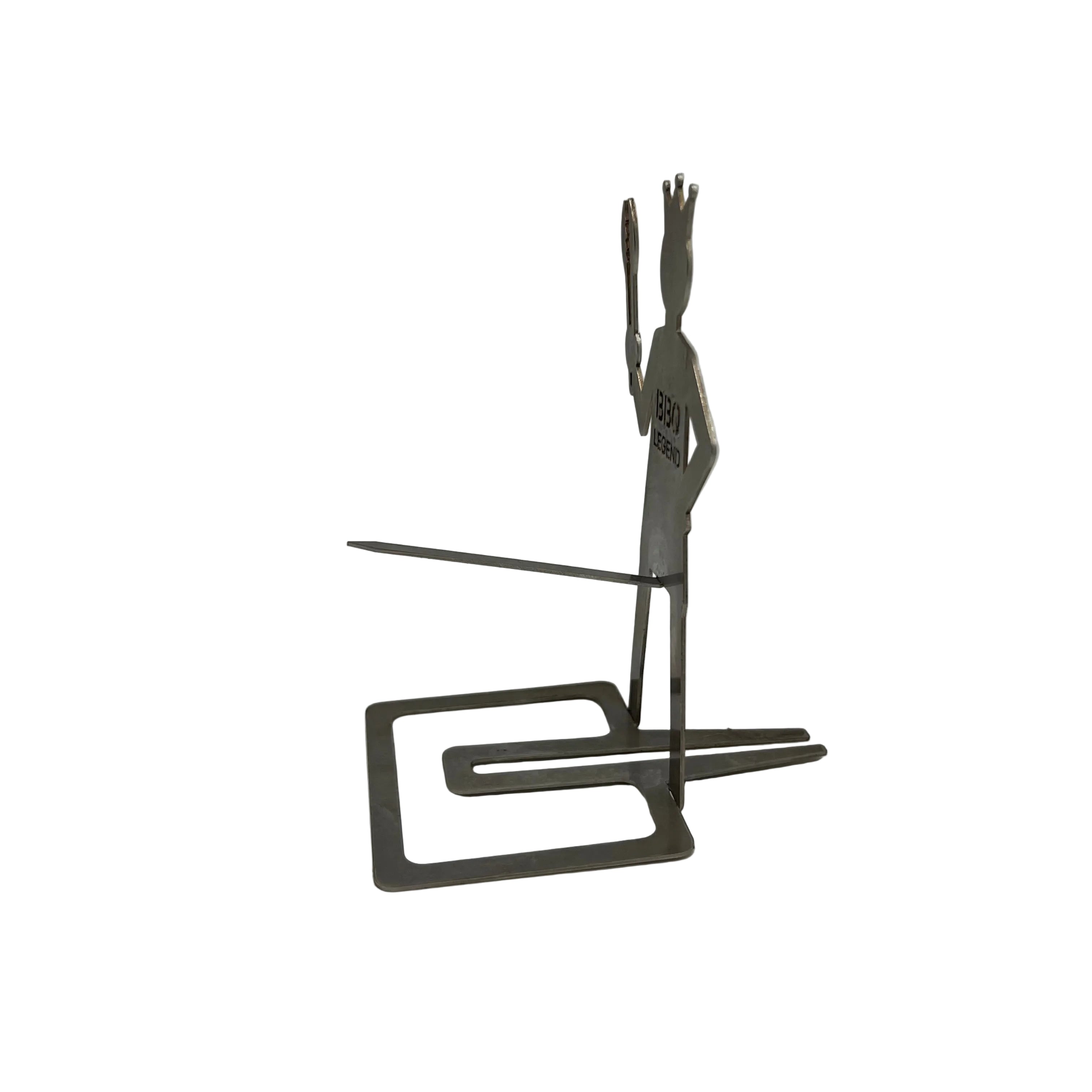 Metal sculpture of a person on a stand against a plain background