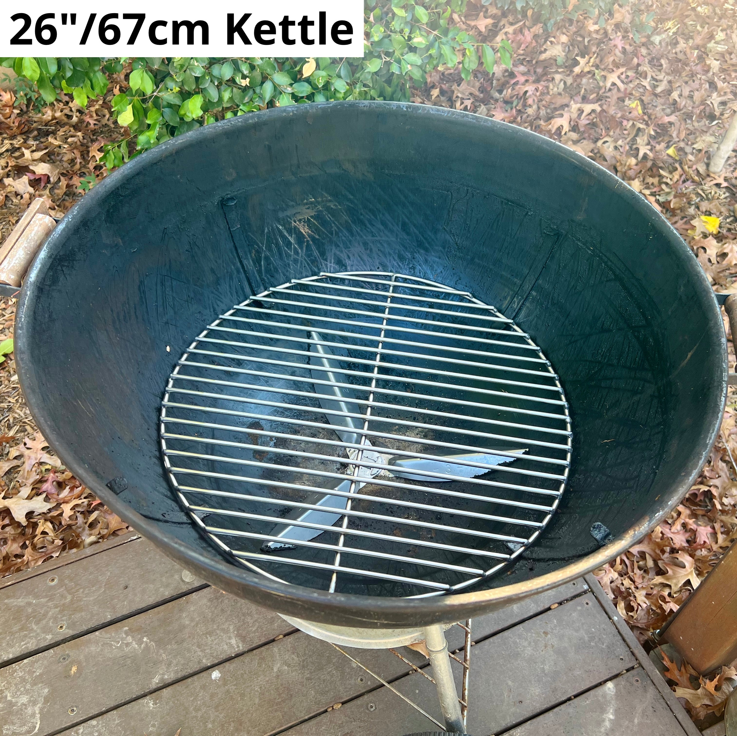 67cm charcoal grate fitted to a blue weber kettle sitting on a deck