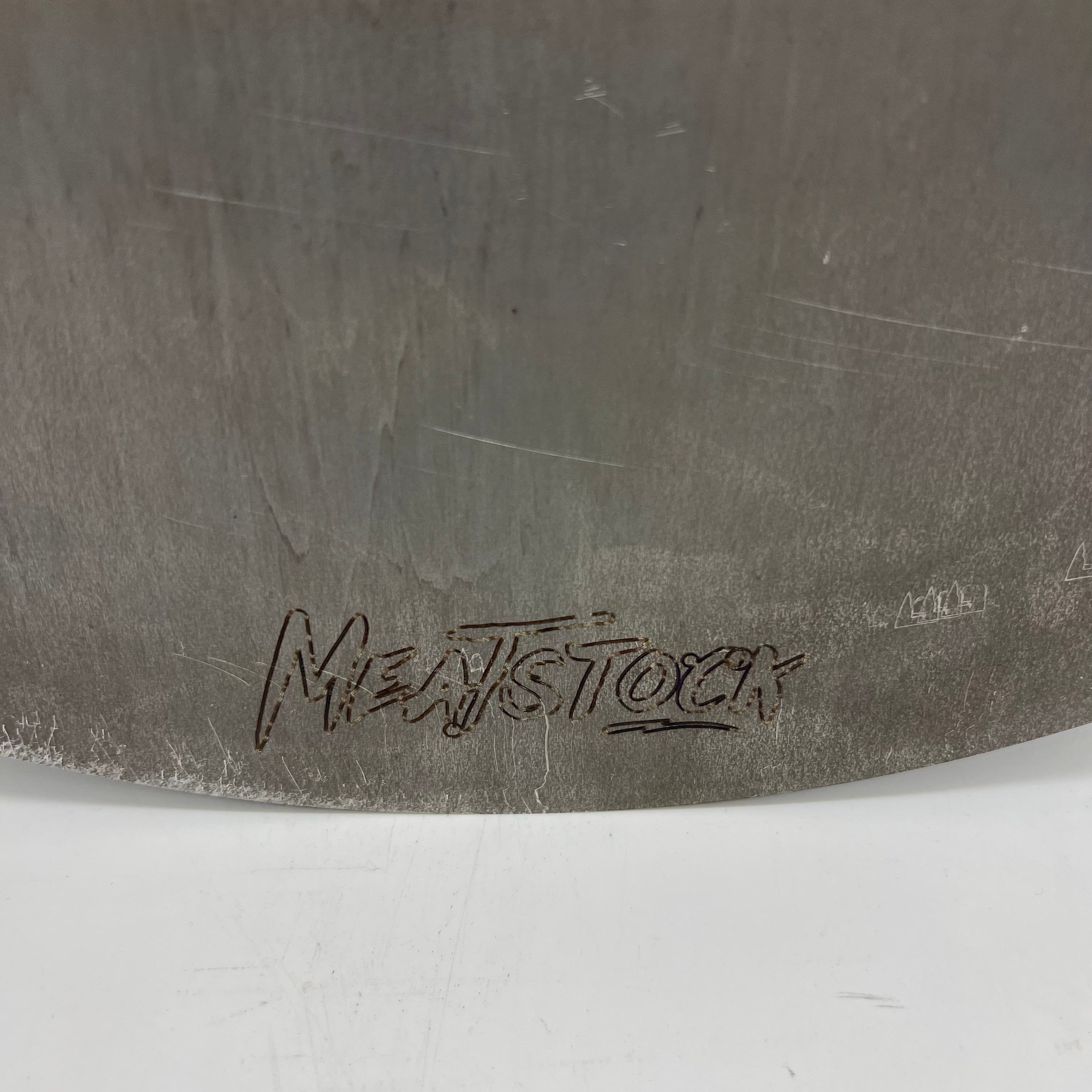 Meatstock logo to on a mild steel griddle plate
