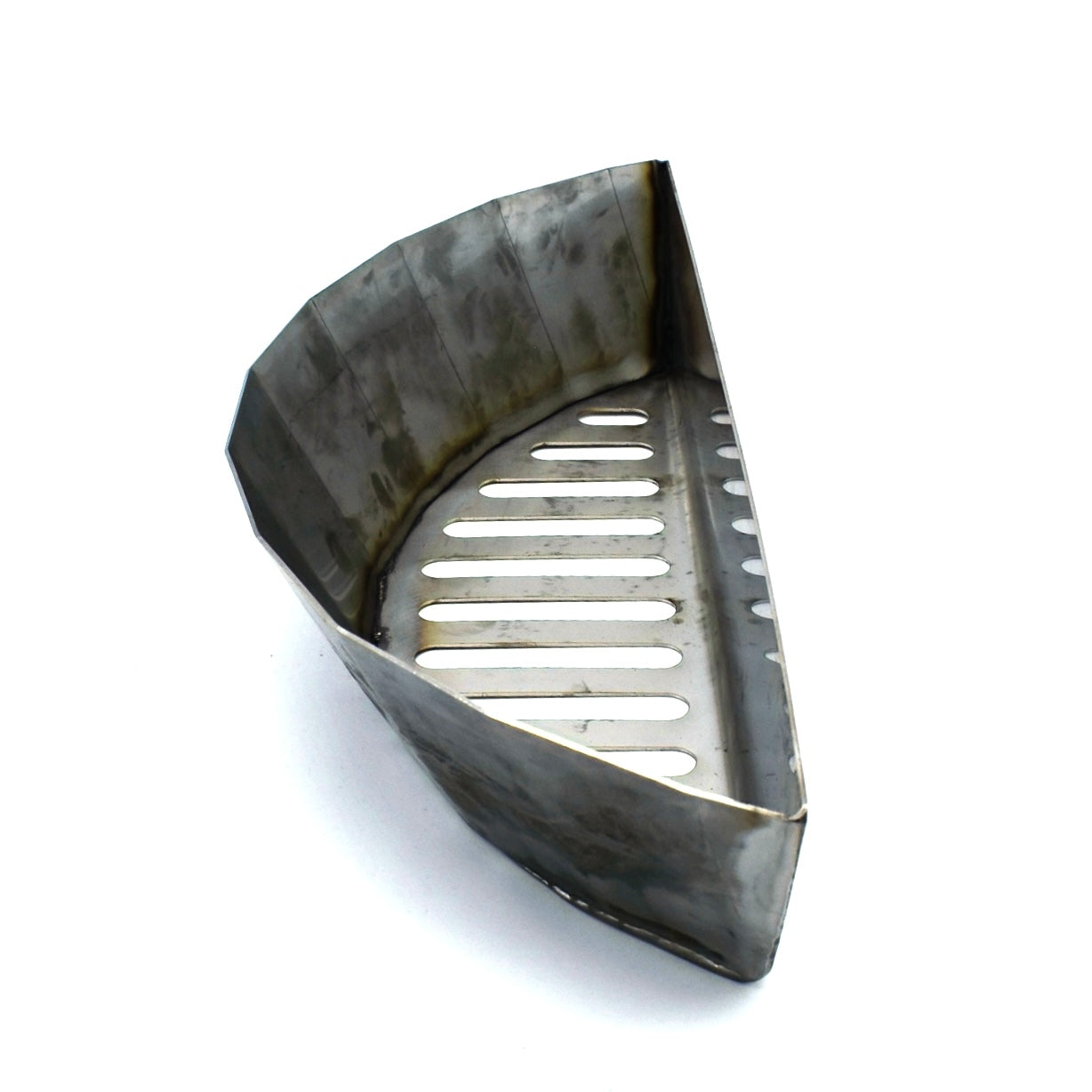 Slow N Sear style basket in stainless steel showing top angled view of the crescent moon shape.
