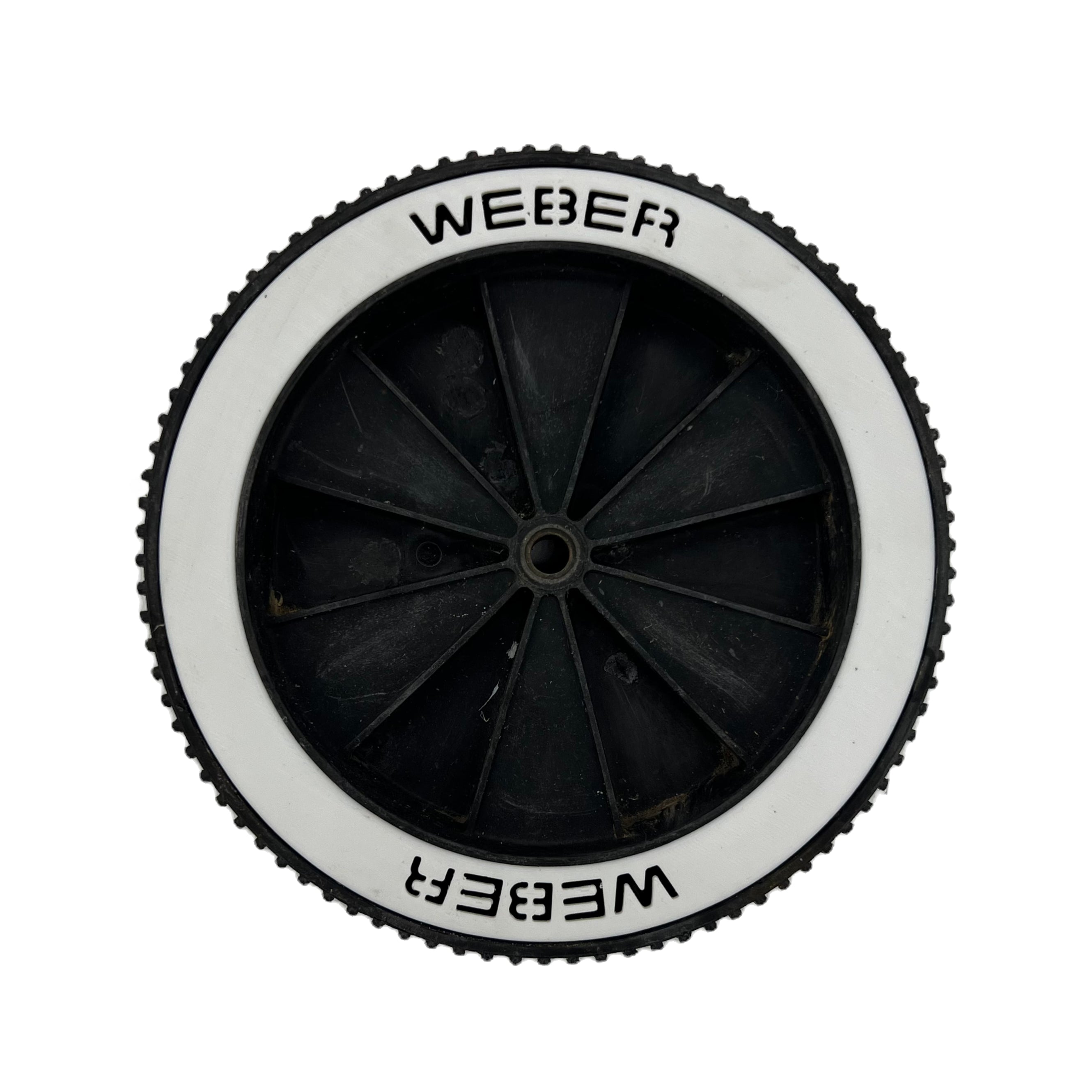 Old school weber genesis wheel inserts installed into a wheel with a white background