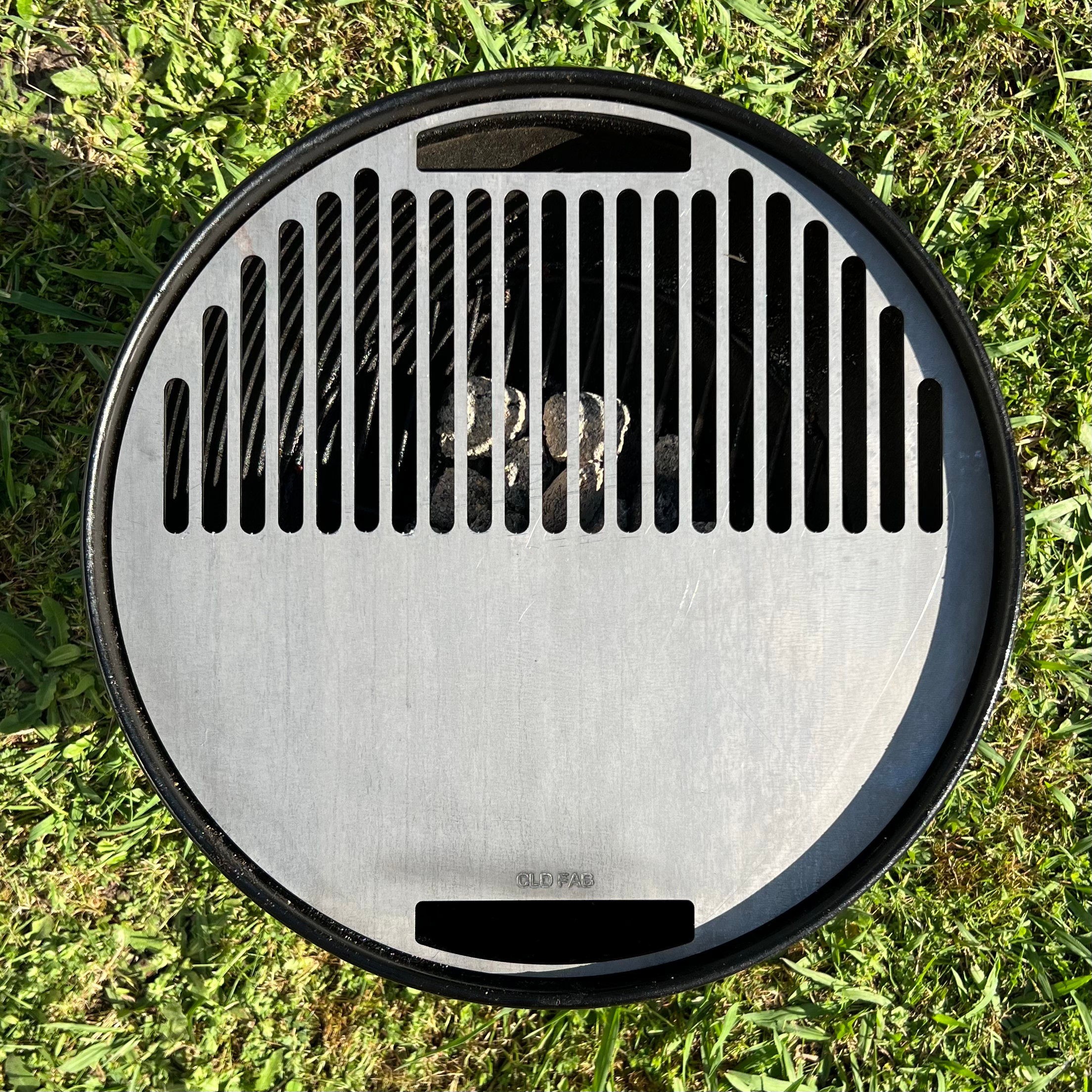 Smokey joe griddle installed with a grass background, top view