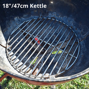 47cm charcoal grate fitted to a red weber kettle grass background