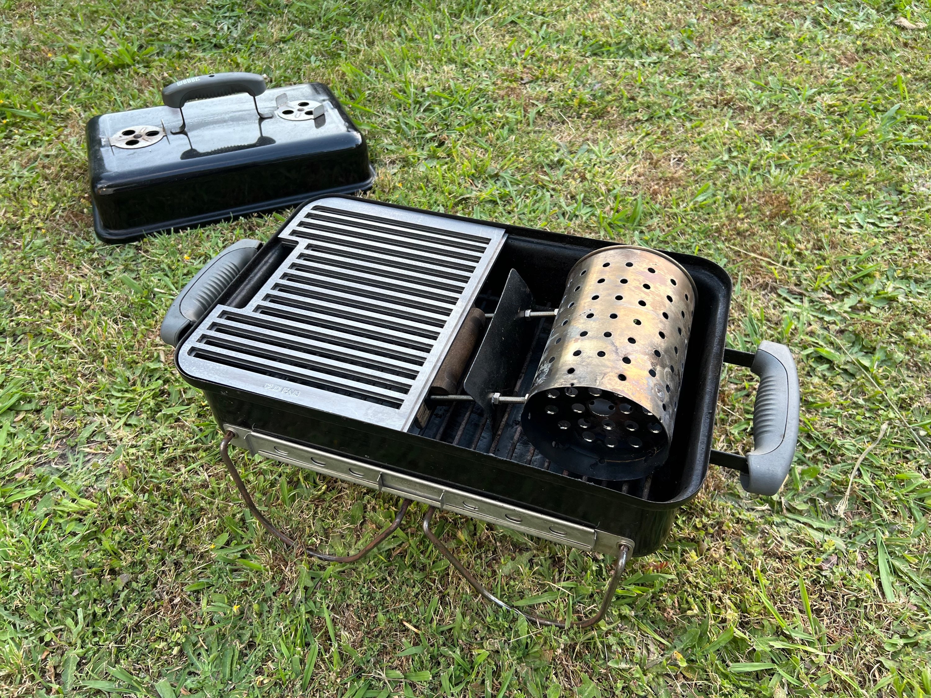 angled view of the half grill fitted with a chimney inside