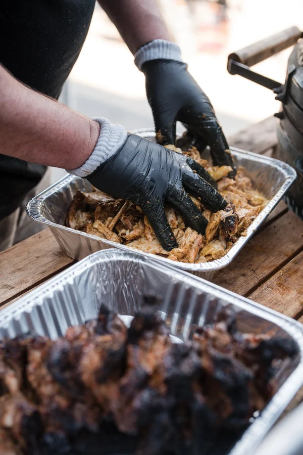 BBQ class participants learning low and slow smoking techniques at Firehouse Barbecue