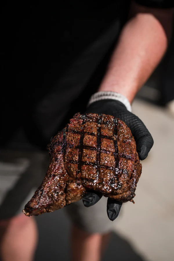 Guests enjoying smoked meats at an American BBQ class hosted by Firehouse Barbecue