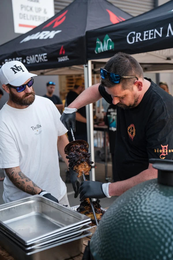 Smoked meat being sliced and served at an American BBQ class in Melbourne