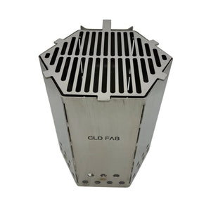 CLD Fabrication stainless steel charcoal chimney fitted with the optional slotted top cooking grill, viewed from the front.