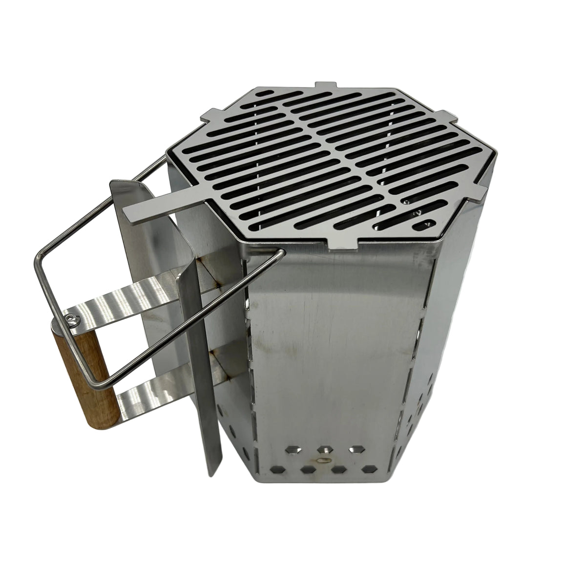 Angled view of CLD Fabrication charcoal chimney with optional top cooking grill, timber grip, heat shield and assist handle.